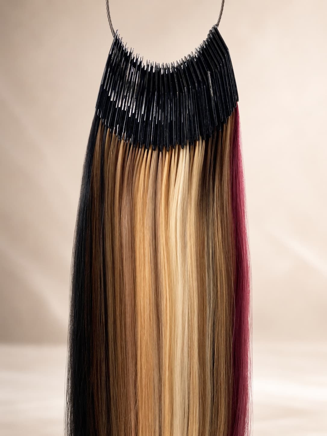 The SMJ Hair color ring — the full range of raw-hair shades fanned on a single ring